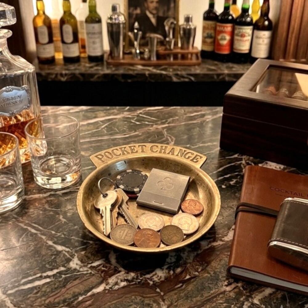 vintage brass valet dish typically used to collect loose coins, keys, or jewelry
